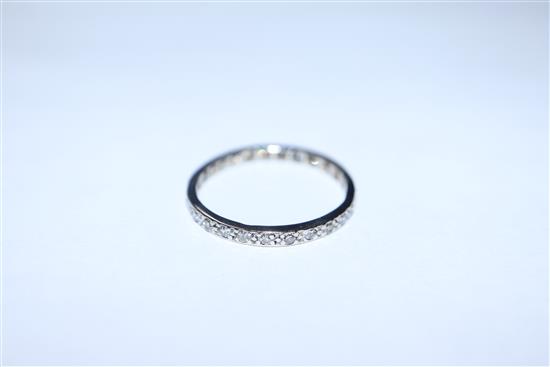 A white metal and diamond set full eternity ring, size R.